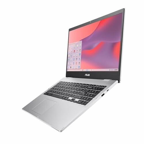 Silver Asus laptop with open screen displaying desktop