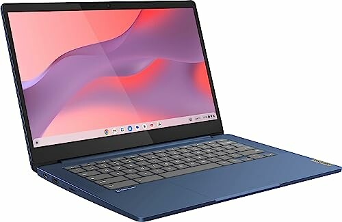 Blue laptop open with screen displaying abstract pink and purple design