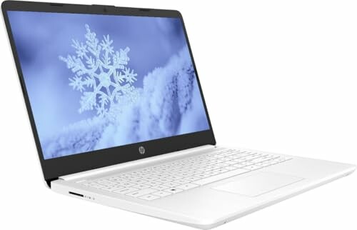 Open HP laptop displaying a snowflake image on the screen.