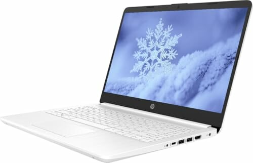 White laptop displaying a snowflake on the screen